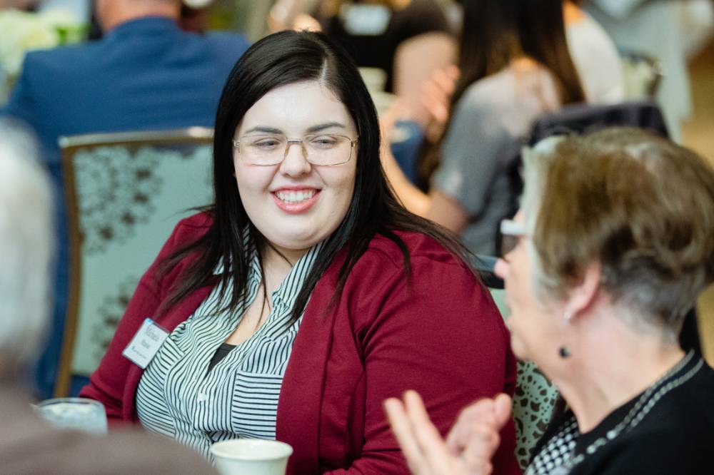 Guest smiling at Scholarship Dinner 2019